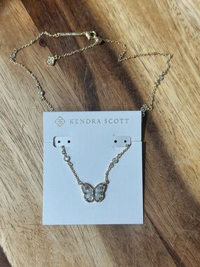 Kendra Scott NEW Gold Butterfly Necklace with Gray Butterfly shaped Stone.